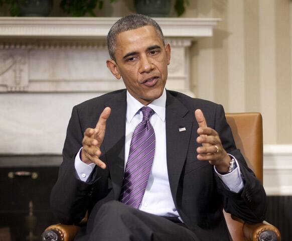 President Barack Obama answers a question on the ongoing conflict in Syria, during their his meeting with Jordan`s King Abdullah in the Oval Office of the White House in Washington.