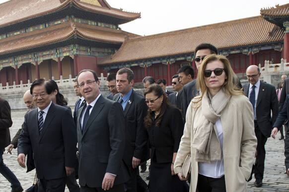 France`s President Francois Hollande, center, and his partner Valerie Trierweiler, right, visit the Forbidden City in Beijing.
