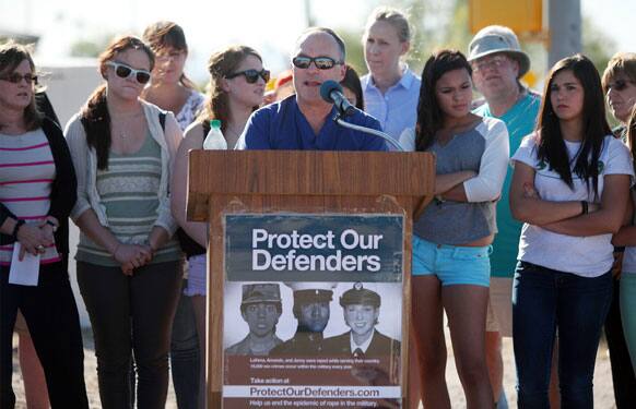 The protesters rallied to denounce the Air Force`s decision to transfer Lt. Col. James Wilkerson to Arizona after his sexual assault conviction was overturned by a commander, adding to the growing criticism of the military justice system.