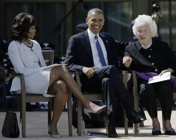 First Lady Michelle Obama and President Barack Obama, react as former first lady Barbara Bush gestures during the dedication of the George W. Bush Presidential Center, in Dallas.