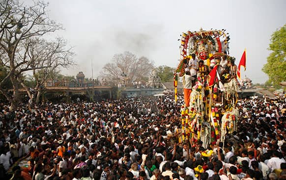 An idol of warrior god Aravan is taken in a chariot during the annual eunuch festival at Koovagam, in the southern Indian state of Tamil Nadu.