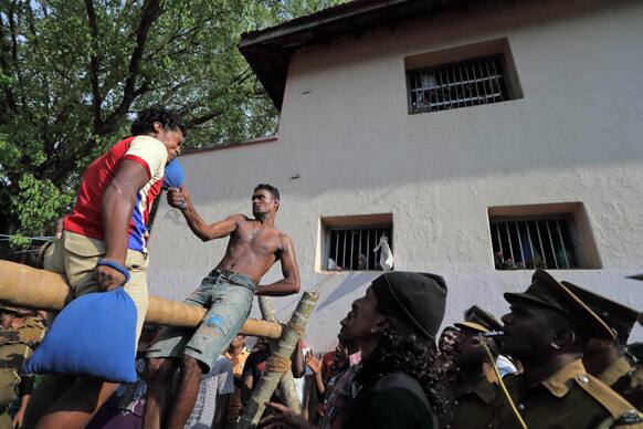 Sri Lankan inmates of Magazine Prison take part in a traditional pillow fight during an event at the prison in Colombo. The event was organized to mark the Sinhalese and Tamil New Year.