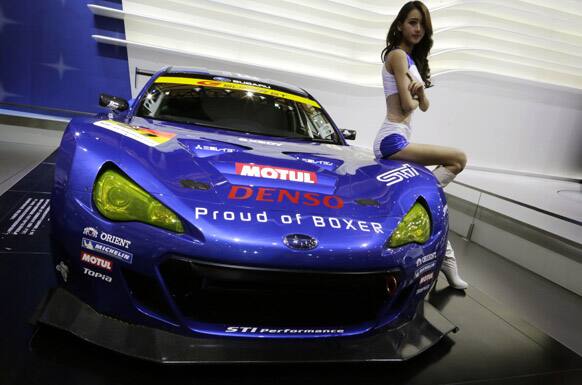 A model poses at Subaru`s booth at the Shanghai International Automobile Industry Exhibition (AUTO Shanghai) in China.