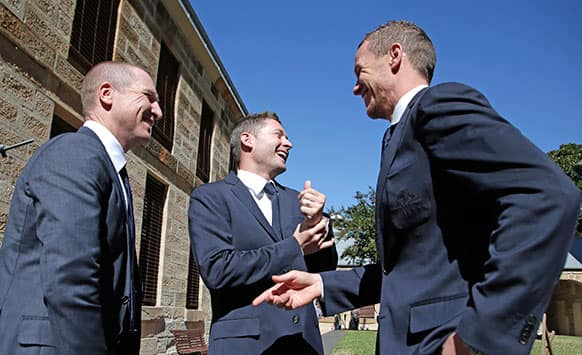 Australian test cricket captain Michael Clarke, center, laughs along with newly appointed vice captain Brad Haddin, left, and fast bowler Peter Siddle in Sydney, Australia, following the announcement of the squad to tour England for the Ashes series.