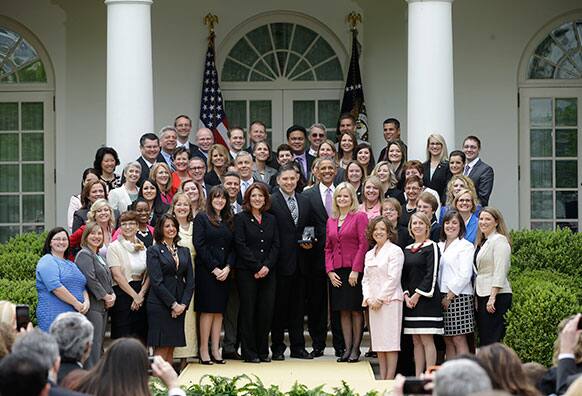 President Barack Obama poses with the 2013 National Teacher Year, Jeff Charbonneau, center, who teaches at Zillah High School in Zillah, Wash., Education Secretary Arne Duncan, left center, and other finalist during a ceremony in the Rose Garden of the White House in Washington.