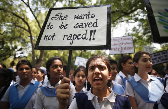Students shout slogans as they hold placards demanding stringent punishment to rapists during a protest in New Delhi.