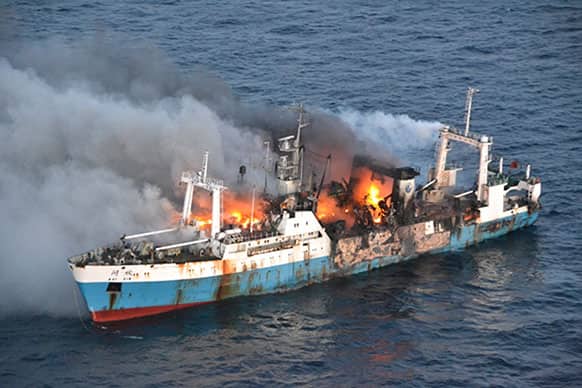 In this picture taken on Friday, April 19, 2013, released by Chile`s Air Force, Chinese factory fishing ship Kai Xin burnt just off the coast of Antarctica.