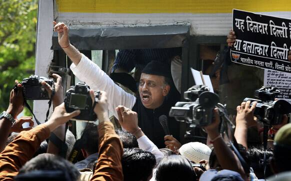 Bharatiya Janta Party senior leader Vijay Goel shouts slogans as he is detained by Delhi policemen during a protest outside the Parliament in New Delhi.