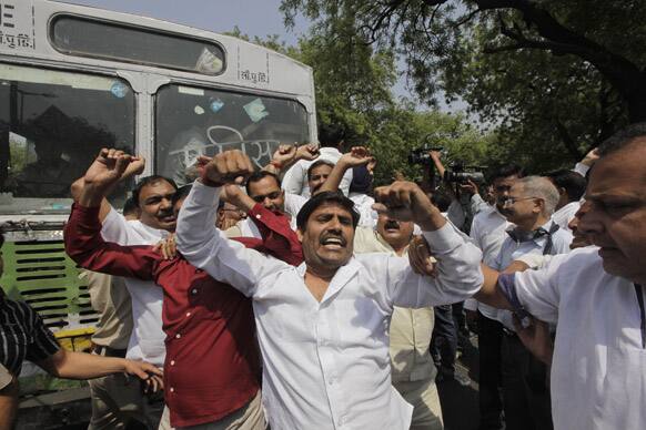 Protesters shout slogans during a protest to demand for tougher rape laws and better police protection for women, outside the Parliament in New Delhi.