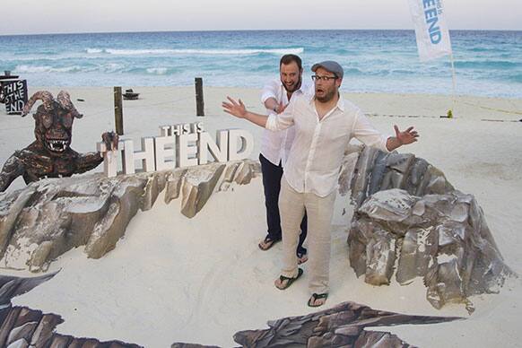 Canadian directors Evan Goldberg, left, and Seth Rogen, pose for photos to promote their upcoming film