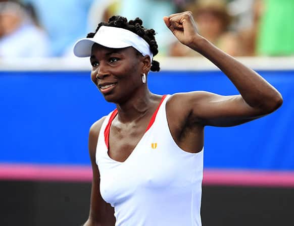 Venus Williams celebrates her victory over Johanna Larsson, of Sweden, in a Fed Cup World Group tennis match, Sunday, April 21, 2013, in Delray Beach, Fla.