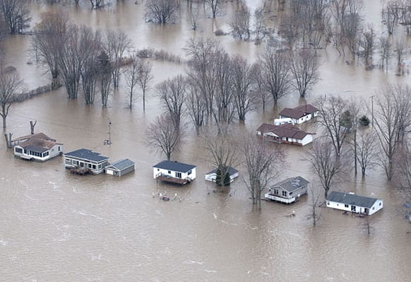 This Saturday, April 20, 2013, photo, provided by the Missouri Department of Public Safety shows flooding in LaGrange, Mo. The Mississippi River is topping out at some problematic spots, but there is growing concern that spring floods are far from over.