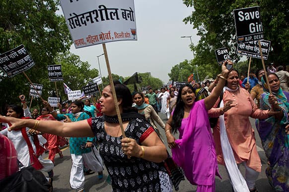 Women activists of India`s main opposition Bharatiya Janata Party shout slogans near the residence of ruling Congress party president Sonia Gandhi during a protest against the rape of a 5-year-old girl in New Delhi.
