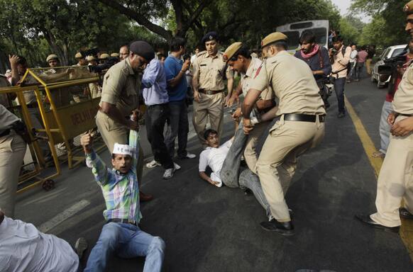 Policemen remove protestors shouting slogans outside Prime Minister`s residence during a protest against the rape of a 5-year-old girl in New Delhi.
