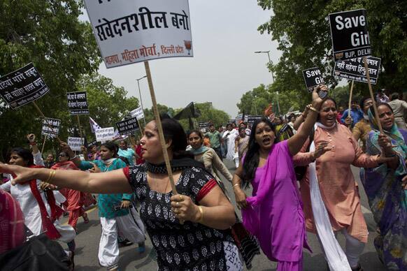 Women activists of India`s main opposition Bharatiya Janata Party shout slogans near the residence of ruling Congress party president Sonia Gandhi during a protest against the rape of a 5-year-old girl in New Delhi.