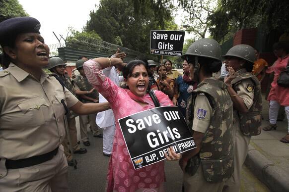An Indian women activist of India main opposition Bharatiya Janata Party shouts slogans outside ruling United Progressive Alliance chairperson Sonia Gandhi’s residence during a protest against the rape of a 5-year-old girl in New Delhi.