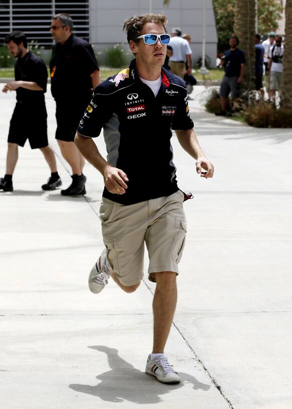 Red Bull driver Sebastian Vettel of Germany, runs as ahead of the Formula One Grand Prix at the Formula One Bahrain International Circuit in Sakhir, Bahrain.