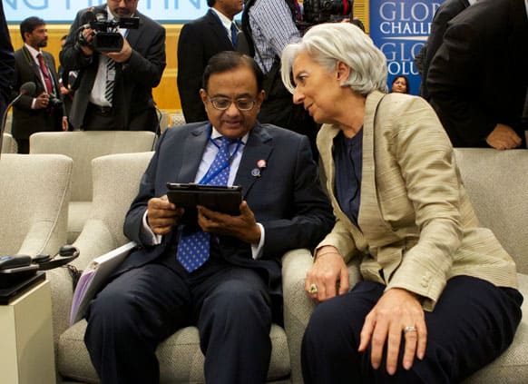 International Monetary Fund Managing Director Christine Lagarde chats with Indian Finance Minister P. Chidambaram before the International Monetary and Financial Committee meeting during the World Bank IMF Spring Meetings in Washington.