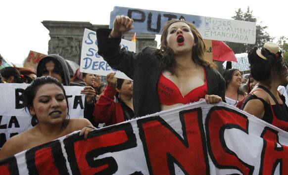 Women chant slogans during a