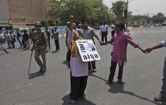 A protester shouts slogans outside Delhi Police headquarters during a protest against the rape of a 5-year-old girl in New Delhi.