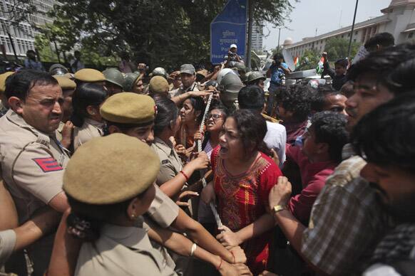 Protesters try to force their way inside Delhi Police headquarters during a protest against the rape of a 5-year-old girl in New Delhi.