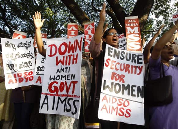 Activists of All India Mahila Samskarika Sanghatana, a women`s organization, shout slogans against the rape and torture of a 5-year-old girl in Delhi, during a protest in Bangalore.