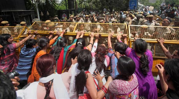 Protestors attempt to break through a barricade outside Delhi Police headquarters during a protest against the rape of a 5-year-old girl in New Delhi.