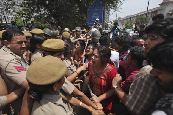 Protesters try to force their way inside Delhi Police headquarters during a protest against the rape of a 5-year-old girl in New Delhi.