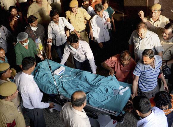 A 5-year-old girl is wheeled into a hospital for treatment after she was raped and tortured in New Delhi.