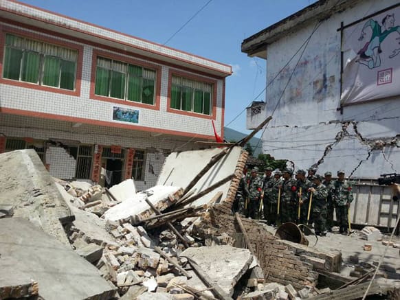 This photo released by China`s Xinhua news agency, buildings are destroyed by a powerful earthquake at Gucheng village of Longmen Township of Lushan County in Ya`an City, southwest China`s Sichuan Province.