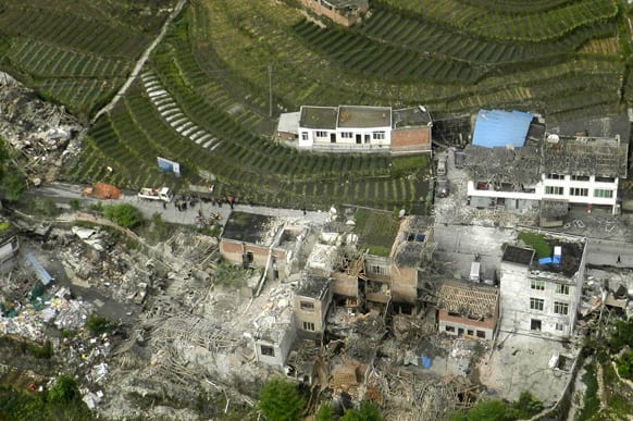 This aerial photo released by China`s Xinhua news agency shows destroyed houses after a powerful earthquake hit Taiping town of Lushan County in Ya`an City, southwest China`s Sichuan Province.