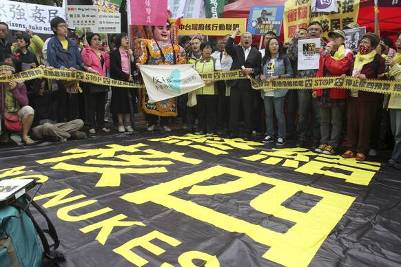 Taiwanese protesters shout slogans during a protest rally outside the Legislative Yuan in Taipei. A group of people gathered in downtown on Friday to protest President Ma Ying-jeou’s government, who promised to hold a referendum on opening a fourth nuclear power plant in Taiwan.