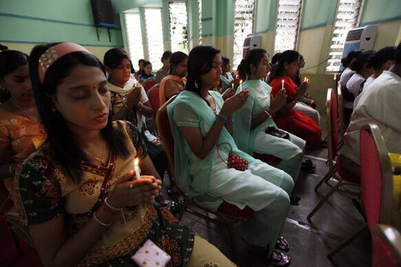 Muslims women pray during a meeting of Interfaith Group (Myanmar) Collective Recitation and Prayer at YMCA in Yangon, Myanmar.