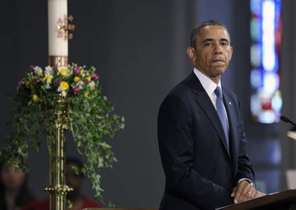 President Barack Obama pauses while speaking at the