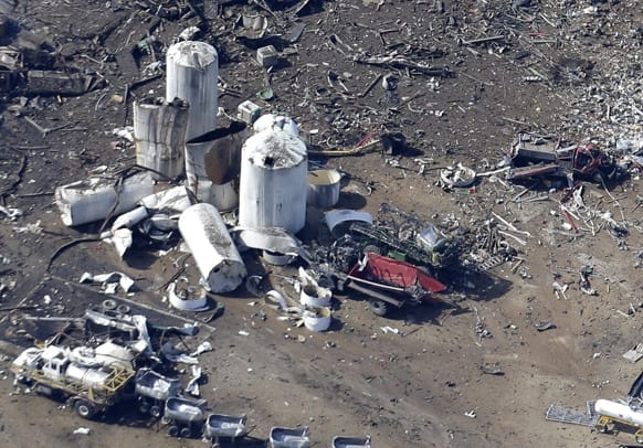 This aerial photo shows the remains of a emergency responders vehicle and a fertilizer plant destroyed by an explosion in West, Texas.