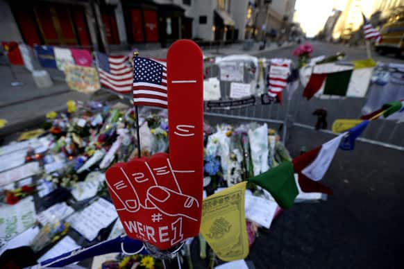 A foam finger stands at a makeshift memorial on Boylston Street in Boston, near the blast site of the Boston Marathon explosions.