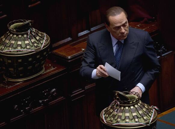 Italian former Premier Silvio Berlusconi casts his ballot for a new president whose first job will be to seek the formation of a new government after inconclusive elections, in Rome.
