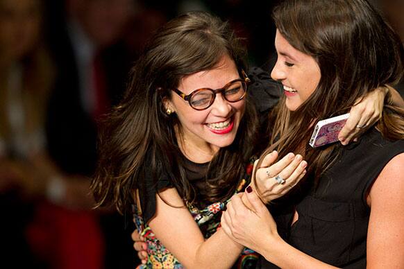 Mexican singer Ximena Sarinana, left, and Mexico`s designer Alejandra Quesada smile at a Mercedes Benz Fashion Week Mexico show in Mexico City.
