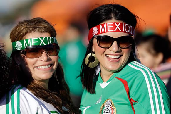 Mexico fans smile before an international friendly soccer match against Peru, in San Francisco.