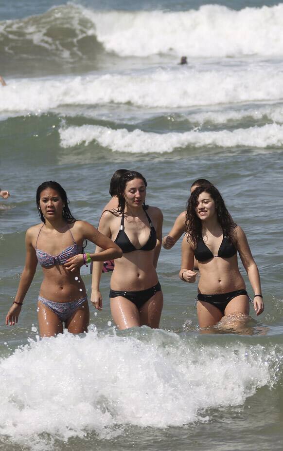 People enjoy the Atlantic Ocean at Biarritz beach, southwestern France, where the temperature reached 30 degrees Celsius.