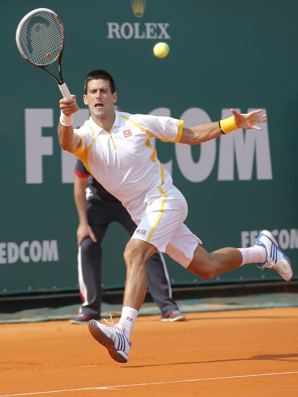 Novak Djokovic of Serbia plays a return to Mikhail Youzhny of Russia during their match of the Monte Carlo Tennis Masters tournament in Monaco.