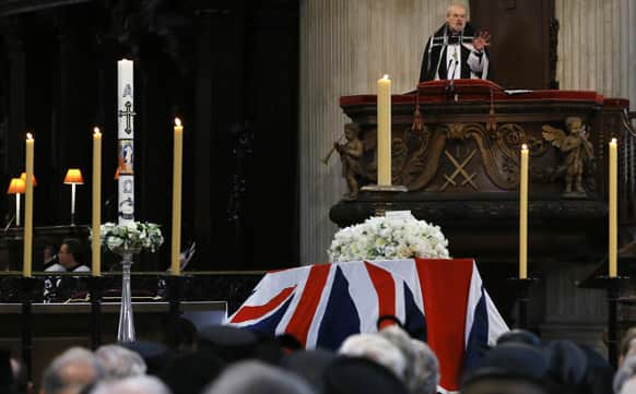 The Bishop of London Richard Chartres delivers an address near the coffin containing the body of former British Prime Minister Margaret Thatcher during her funeral service in St Paul`s Cathedral in London.