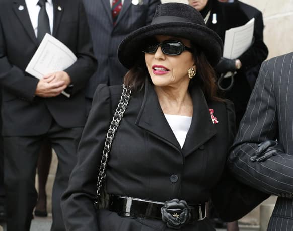 Actress Joan Collins leaves after attending the funeral service of former British Prime Minister Margaret Thatcher at St Paul`s Cathedral, in London.