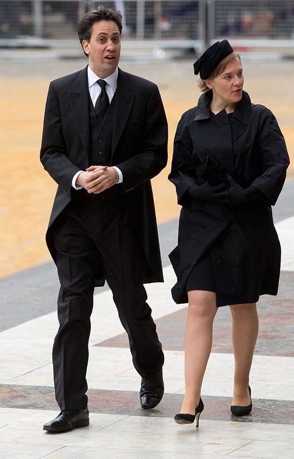 British opposition party leader Ed Milliband, left, and his wife Justine Thornton arrive for the funeral of former British Prime Minister Margaret Thatcher, outside St. Paul`s Cathedral, London.