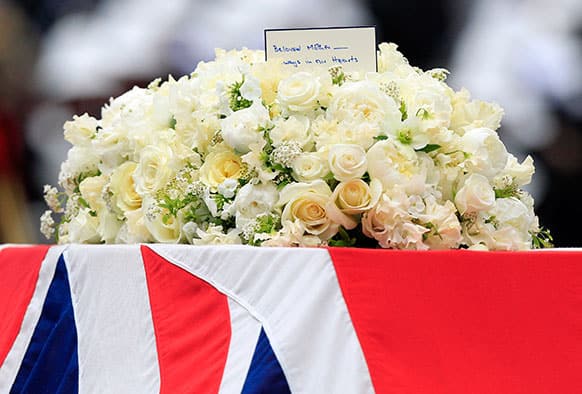 A Union flag draped coffin bearing the body of former British Prime Minister Margaret Thatcher is carried on a gun carriage drawn by the King`s Troop Royal Artillery during her ceremonial funeral procession in London.