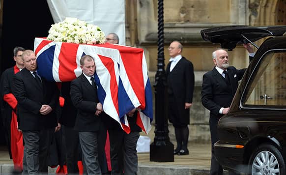 Pallbearers carry the coffin bearing the body of former British Prime Minister Margaret Thatcher as it leaves the chapel of St Mary Undercroft at the Houses of Parliament during her ceremonial funeral in central London.