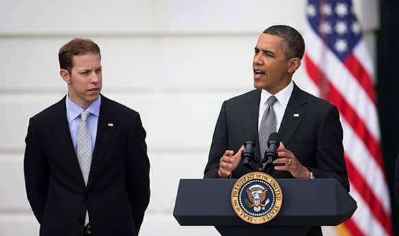 NASCAR driver Brad Keselowski listens as President Barack Obama speaks during a ceremony on the South Lawn of the White House in Washington, honoring Keselowski`s NASCAR Sprint Cup Series championship.