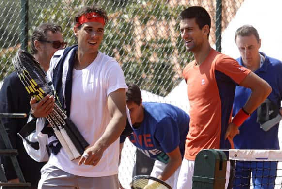 Novak Djokovic of Serbia and Spain`s Rafael Nadal are seen during a practice session at the Monte Carlo Tennis Masters tournament in Monaco.