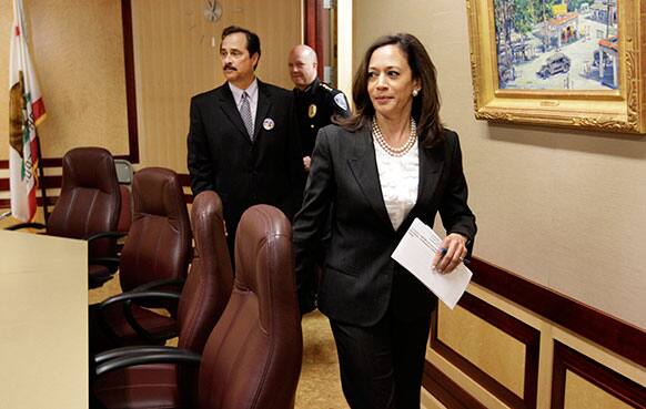 Attorney General Kamala Harris enters a news conference to discuss proposed prescription drug legislation at the Capitol in Sacramento, Calif.
