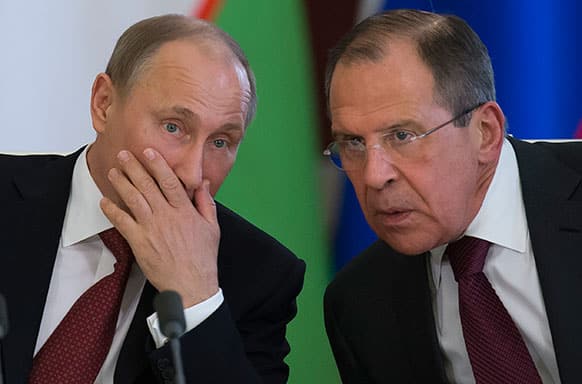 Russian President Vladimir Putin, left, listens to Foreign Minister Sergey Lavrov during a signing ceremony after Russia Uzbek talks in Moscow`s Kremlin, Russia.
